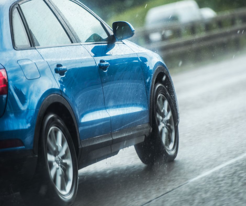 Car driving in the rain. 